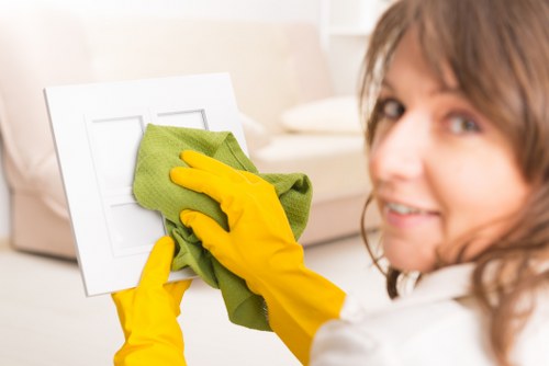 Technician assessing pet urine stains in a Fulham apartment